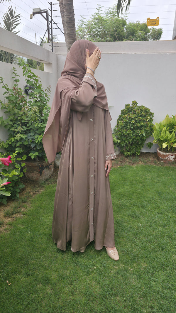 Opal mocha brown abaya, full length in a garden