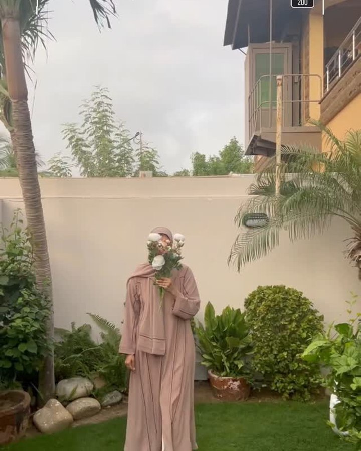 Zayana abaya styled in a garden, Instagram reel